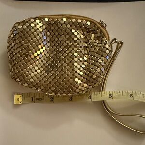 Elegant Gold Sequin like Wristlet with zipper and strap.